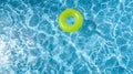 ÃÂ¡olorful inflatable ring donut toy in swimming pool water aerial view from above, family vacation holiday resort Royalty Free Stock Photo